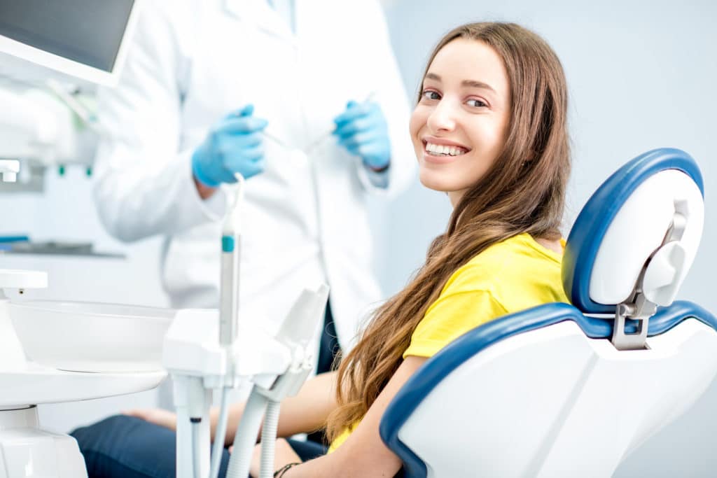 Dentist In Monroe treating a teenage patient